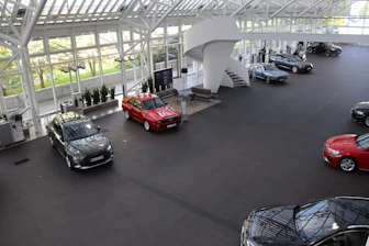 A bunch of cars parked inside of a building