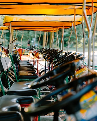 SAAG image of A row of chairs sitting next to each other under umbrellas