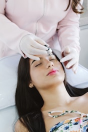 A woman getting her hair cut by a hair stylist