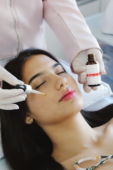 A woman getting botilage treatment from a doctor