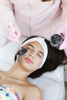 A woman getting her hair cut by a hair stylist