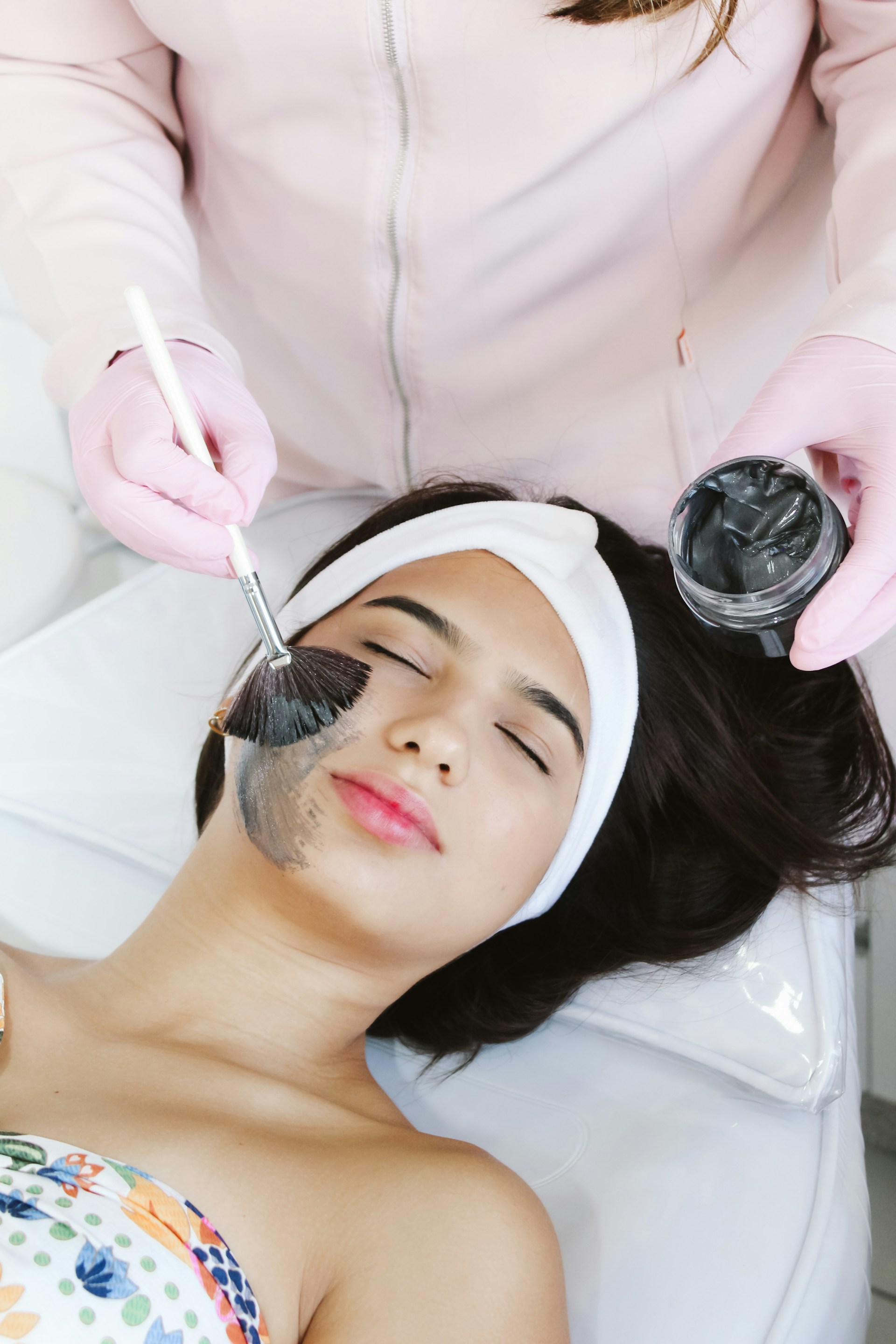 A woman getting her hair cut by a hair stylist