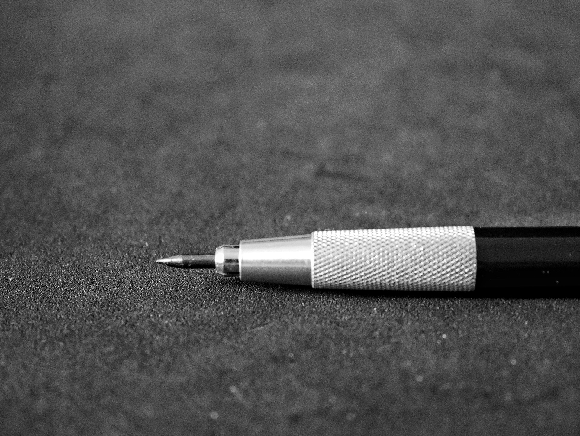 A black and white photo of a pen