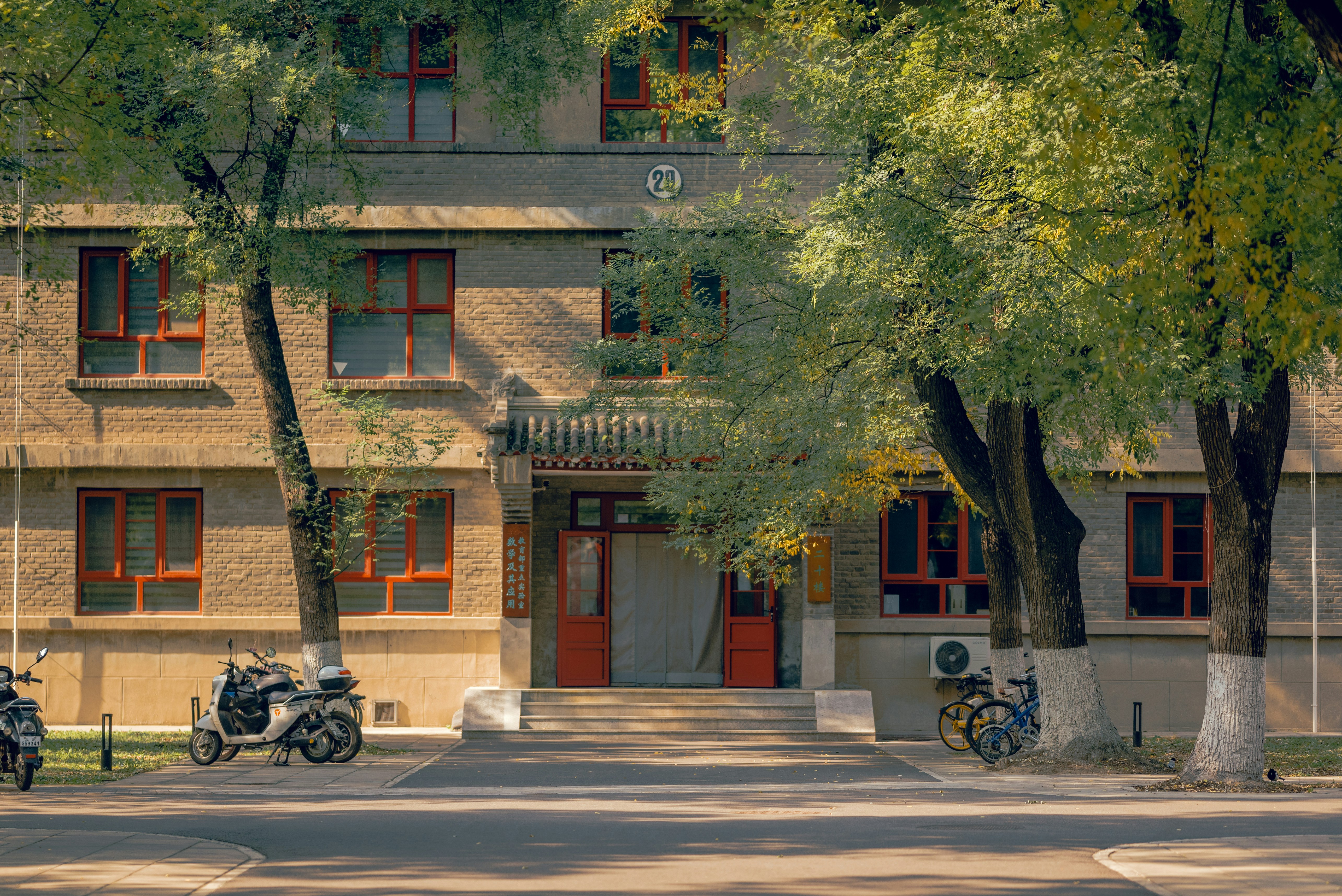 A group of motorcycles parked in front of a building