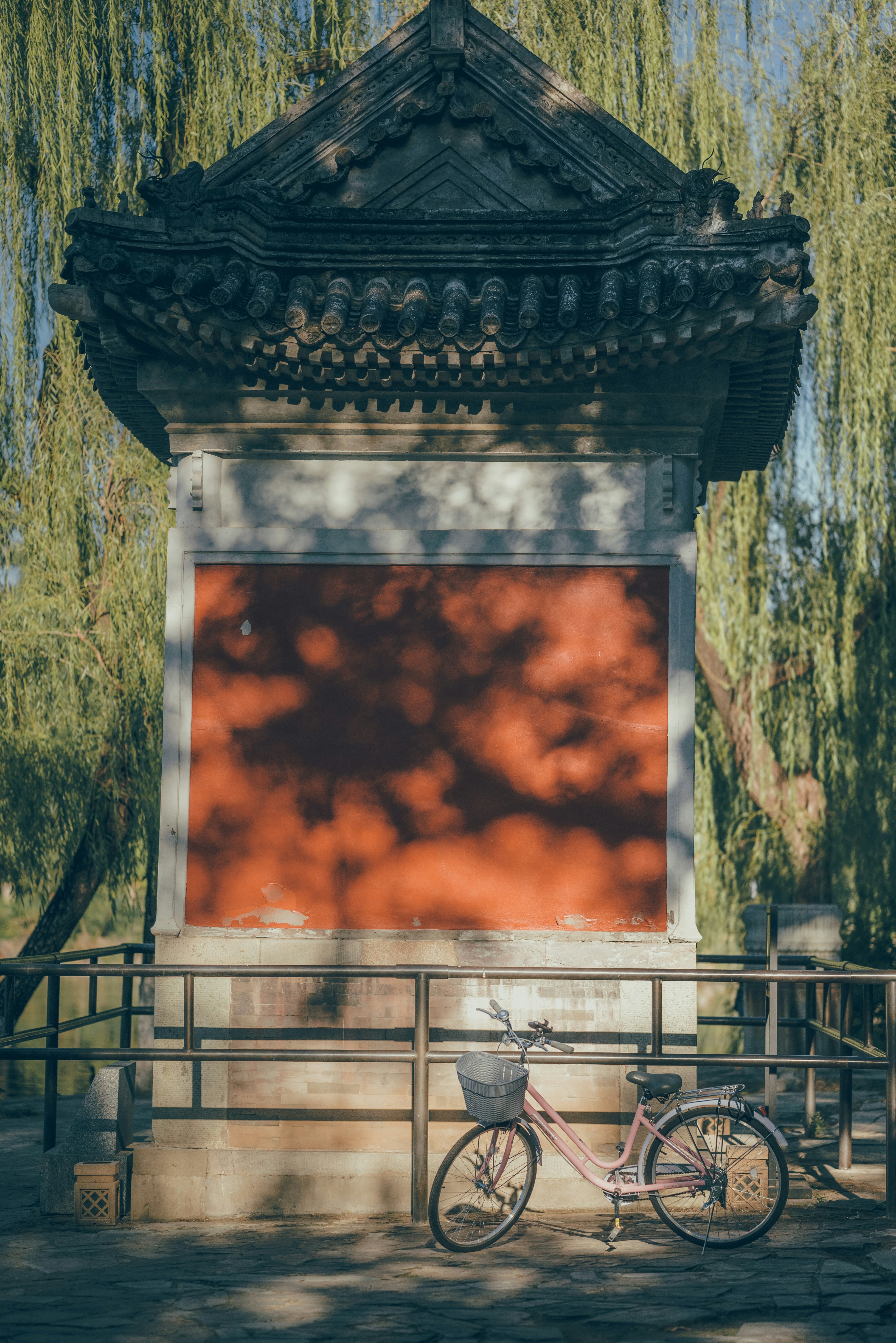 A bike parked in front of a red screen