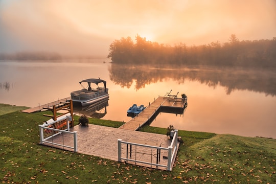 Ontario cottage dock on a quiet lake symbolizing shoreline rules and waterfront property regulations