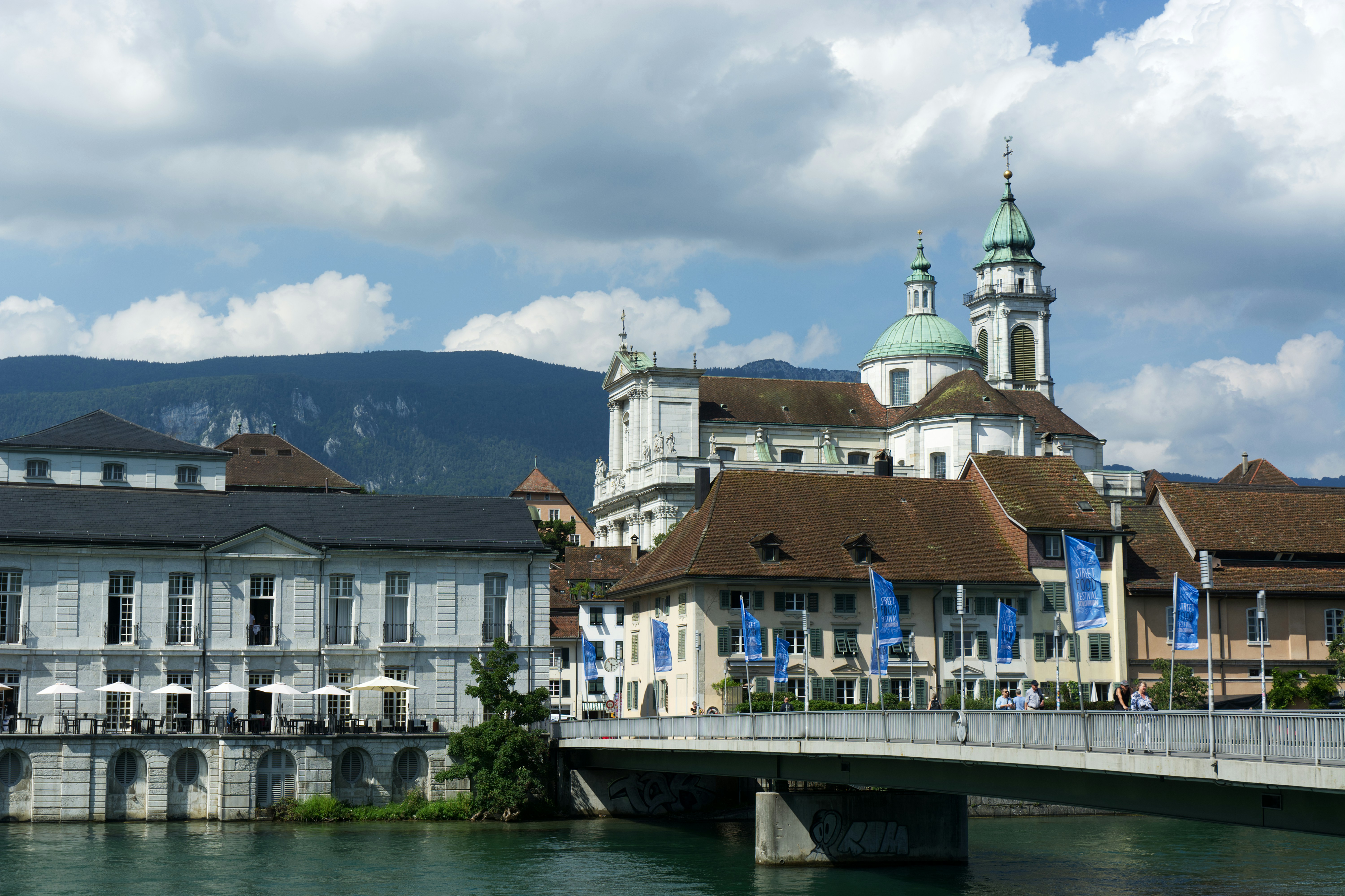 A bridge over a body of water next to buildings