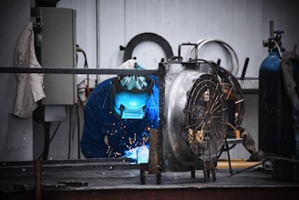 A man working on a machine in a factory
