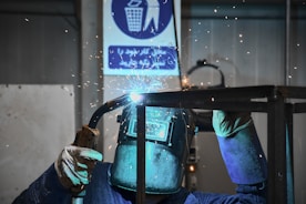 A welder working on a piece of metal