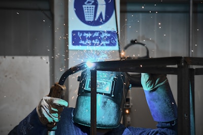 A welder working on a piece of metal