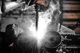 A welder working on a piece of metal