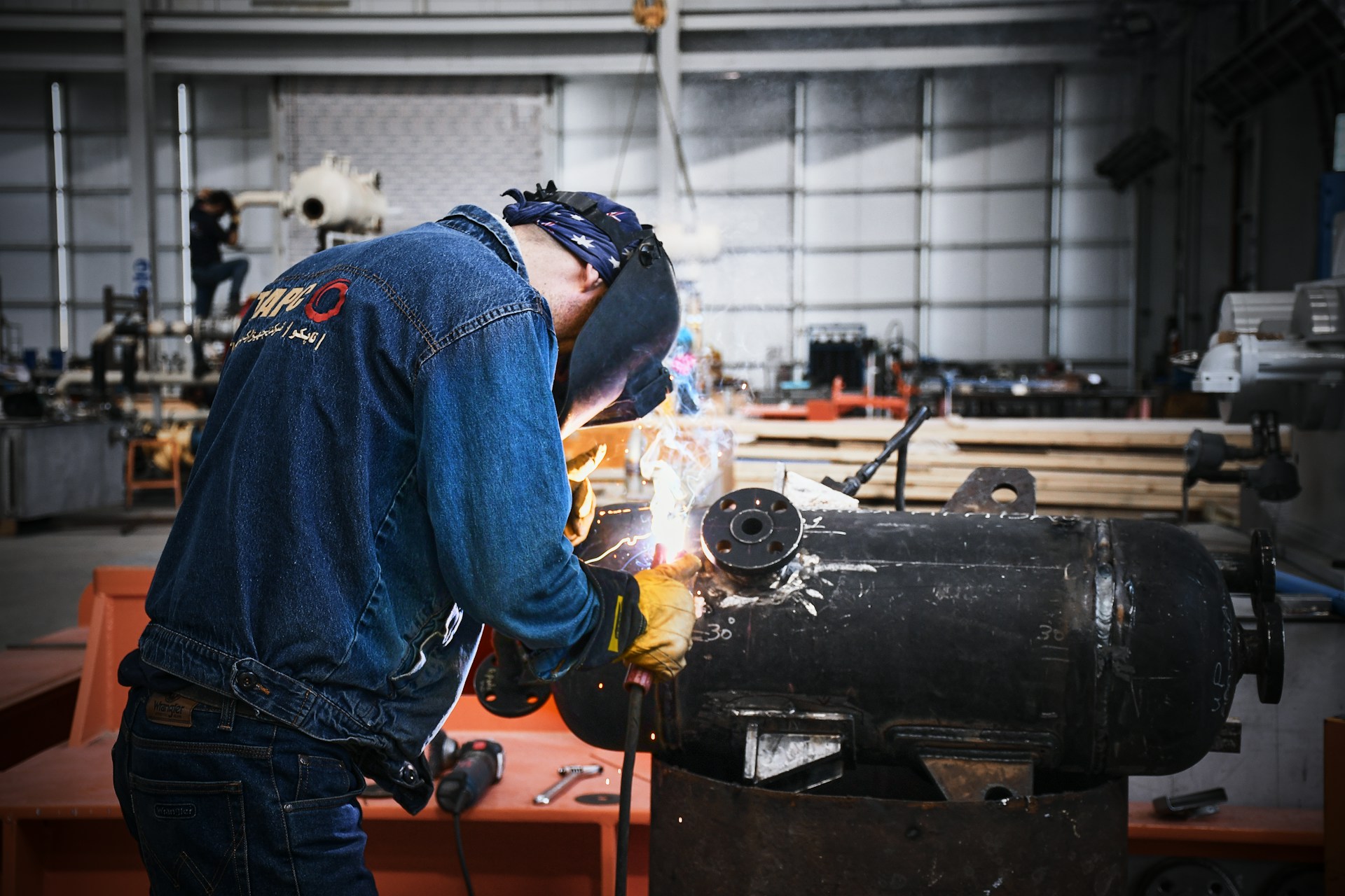 A man working on a machine in a factory