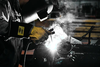 A welder working on a piece of metal