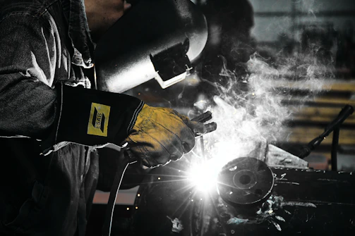 A welder working on a piece of metal