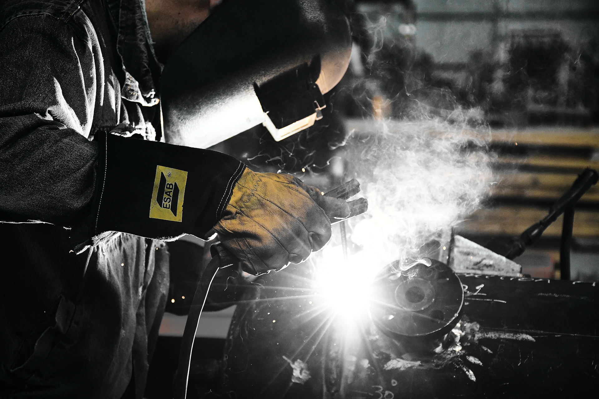 A welder working on a piece of metal