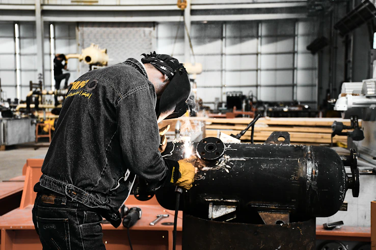A man working on a machine in a factory