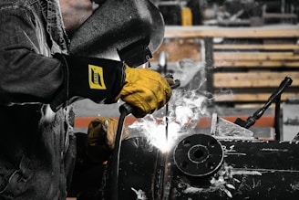 A man working on a machine in a factory