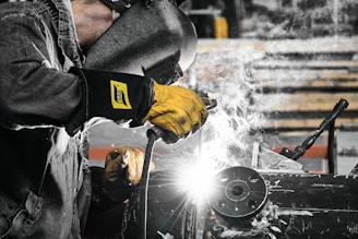 A welder working on a piece of metal