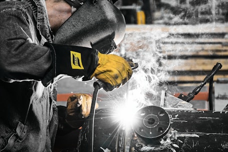 A welder working on a piece of metal