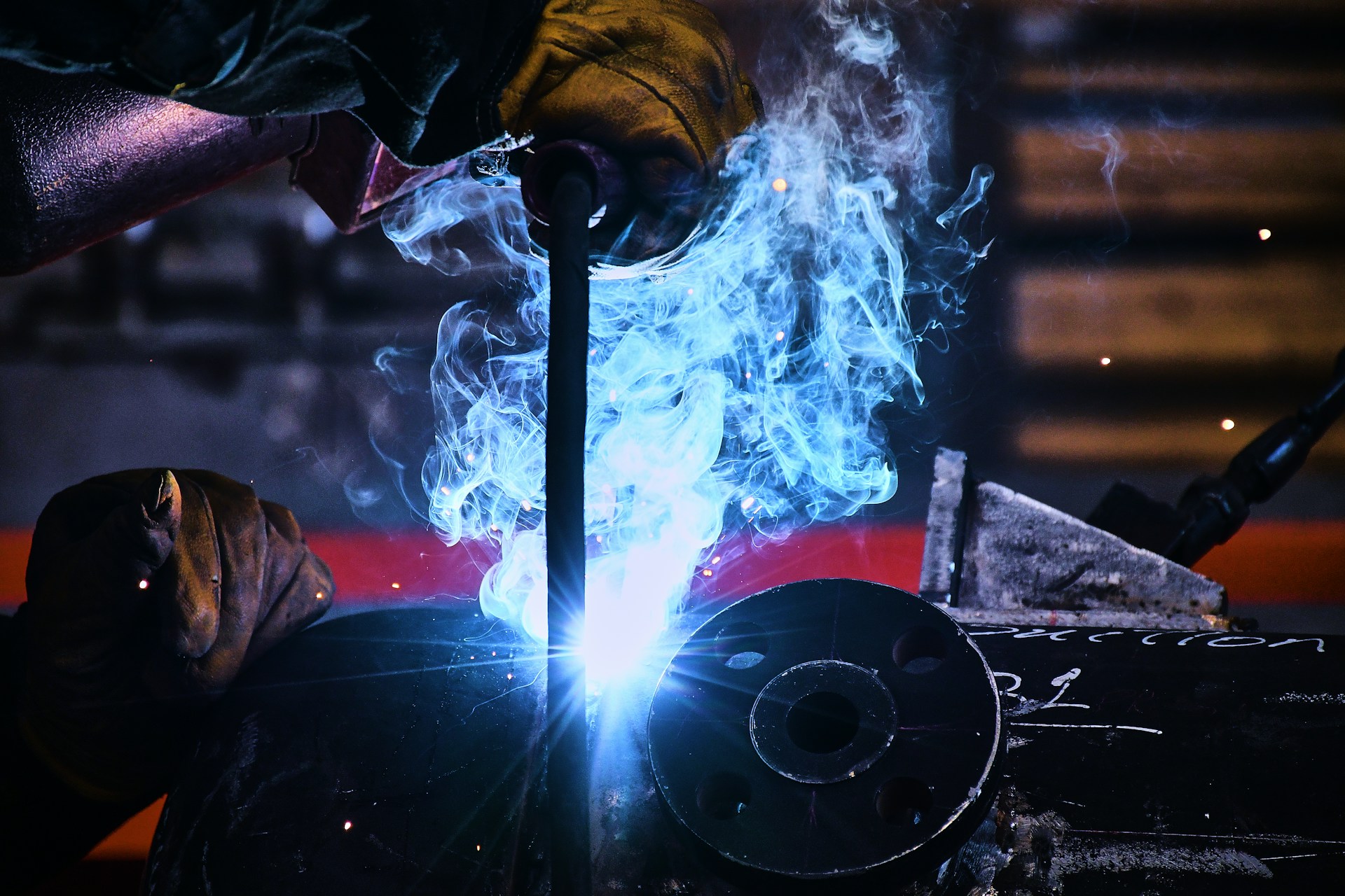 A welder working on a piece of metal