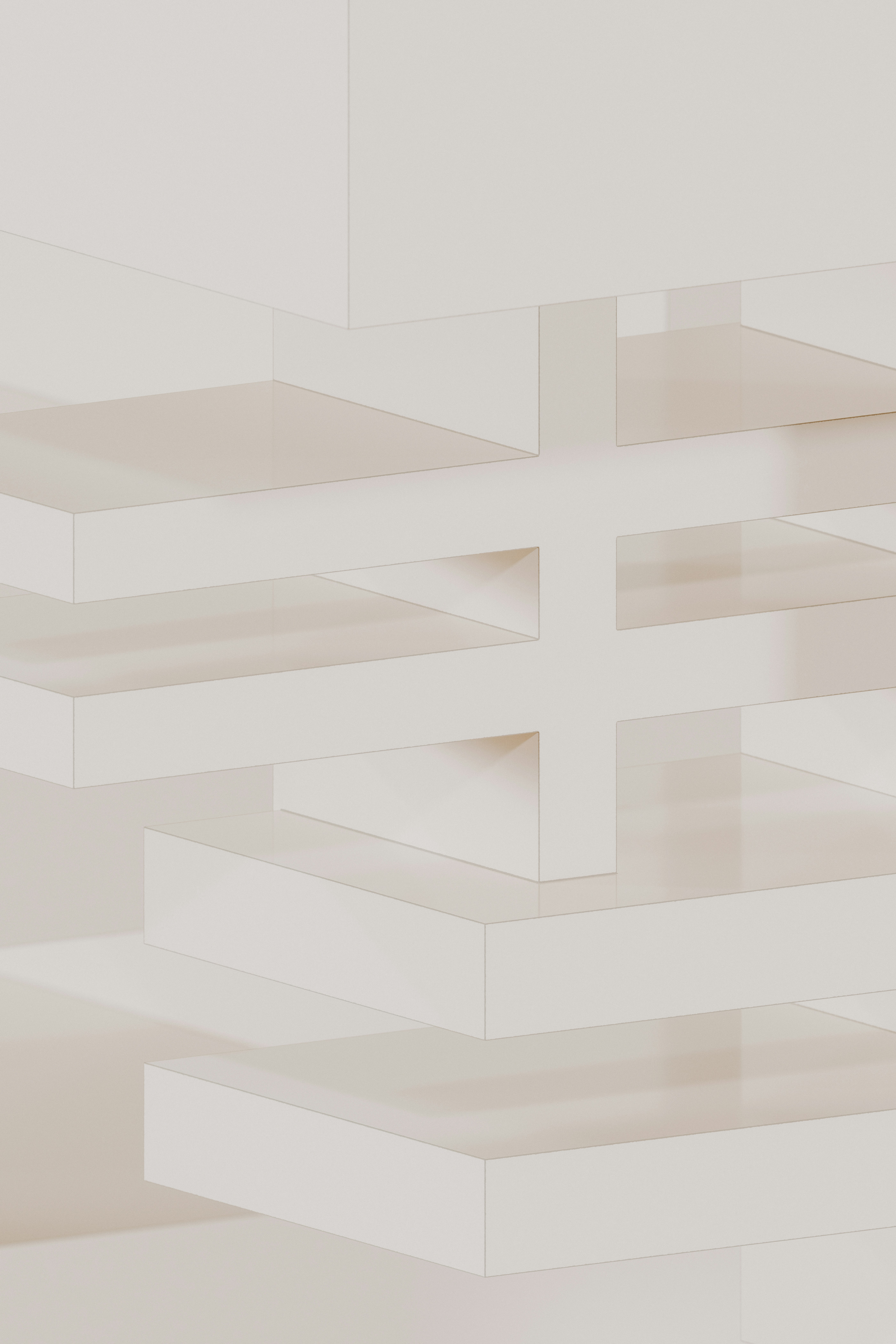 A white wall with a clock on the top of it