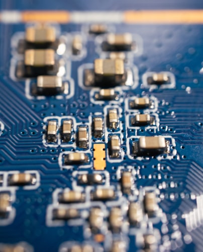 Macro view of a printed circuit board showing a CMOS image sensor module and surrounding microchips