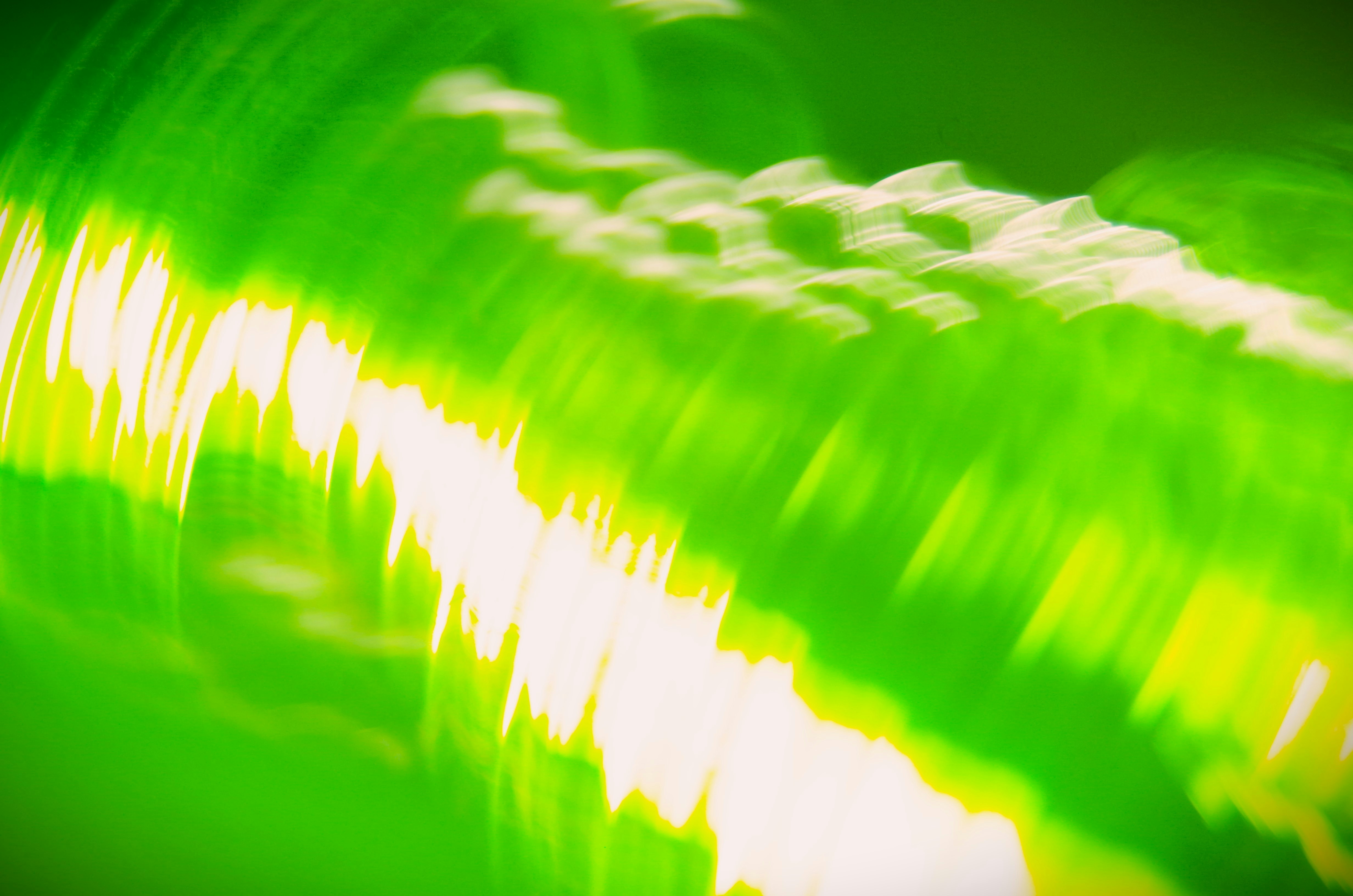 A blurry photo of a green bottle