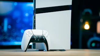 A video game console sitting on top of a wooden table