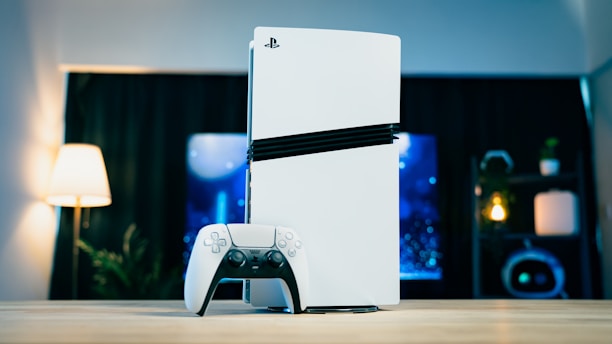 A video game console sitting on top of a wooden table