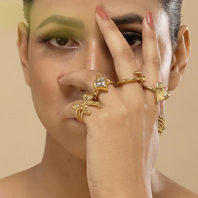 A woman with a ring on her left hand and a ring on her right hand