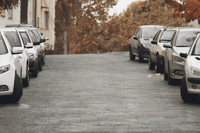 A row of parked cars in a parking lot