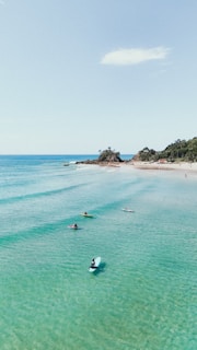 A group of people swimming in the ocean