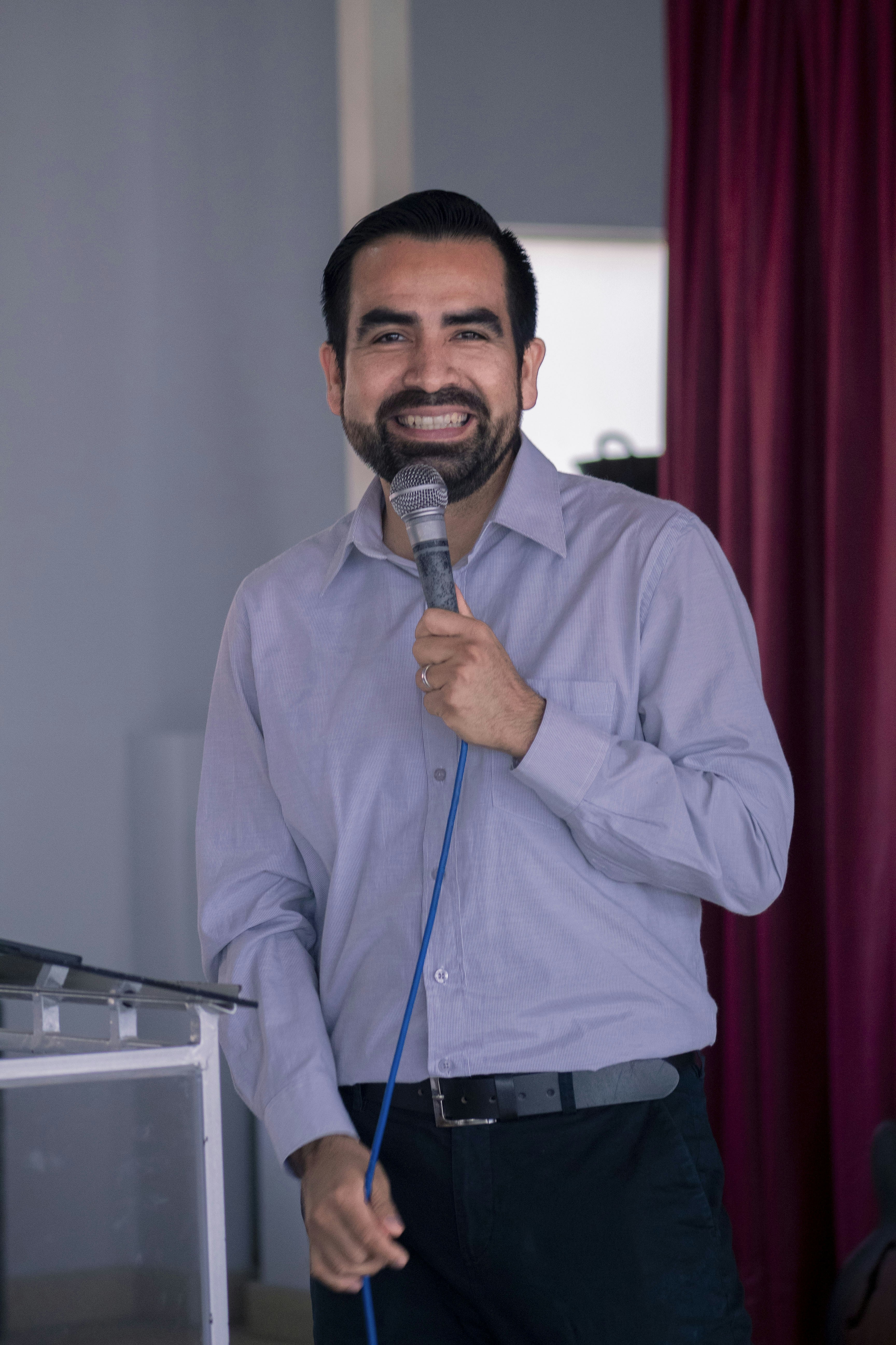 A man standing in front of a microphone