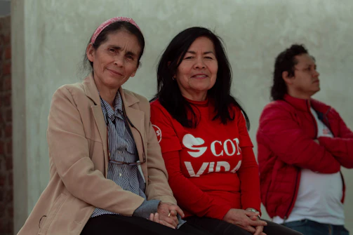 A group of women sitting next to each other