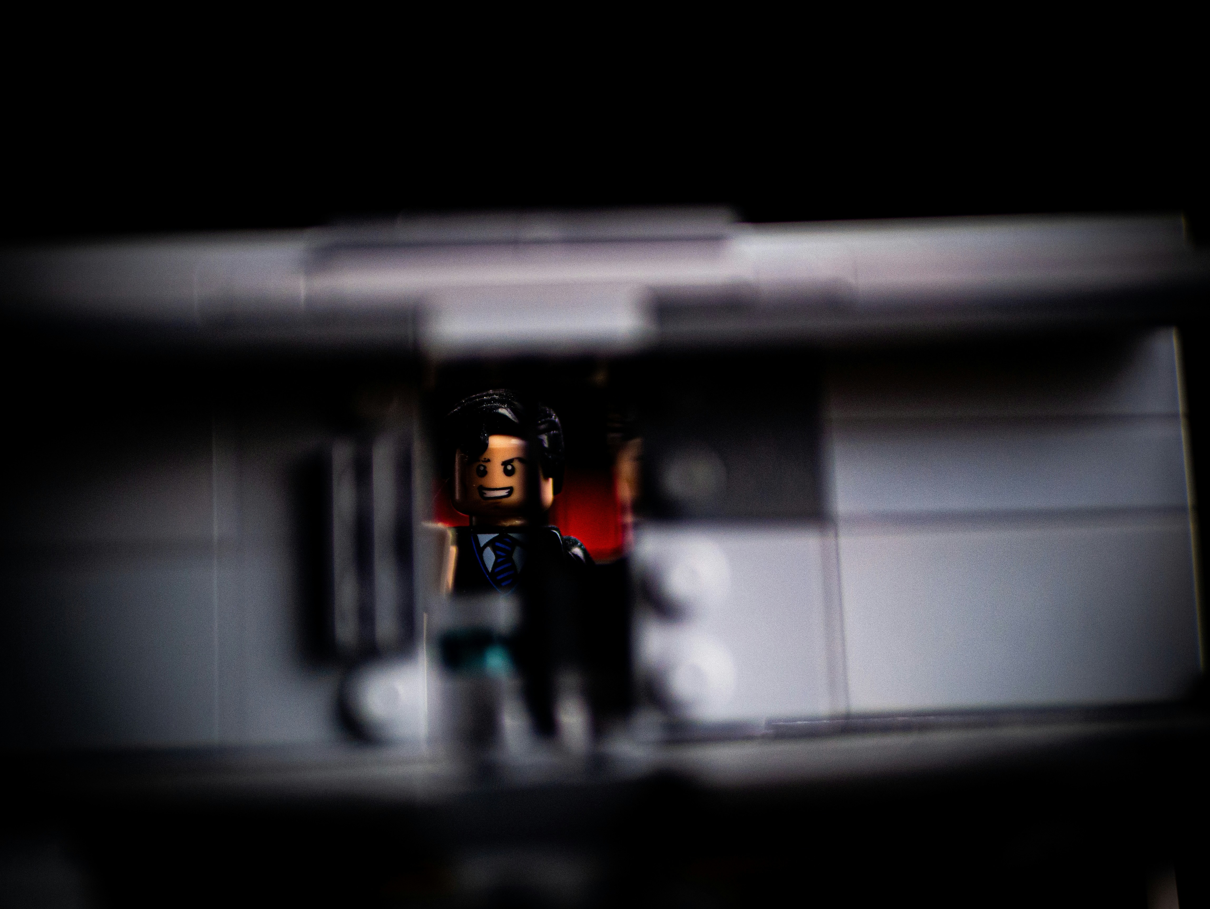 A blurry photo of a man standing in a doorway