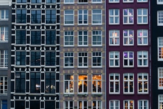 A row of tall buildings with lots of windows