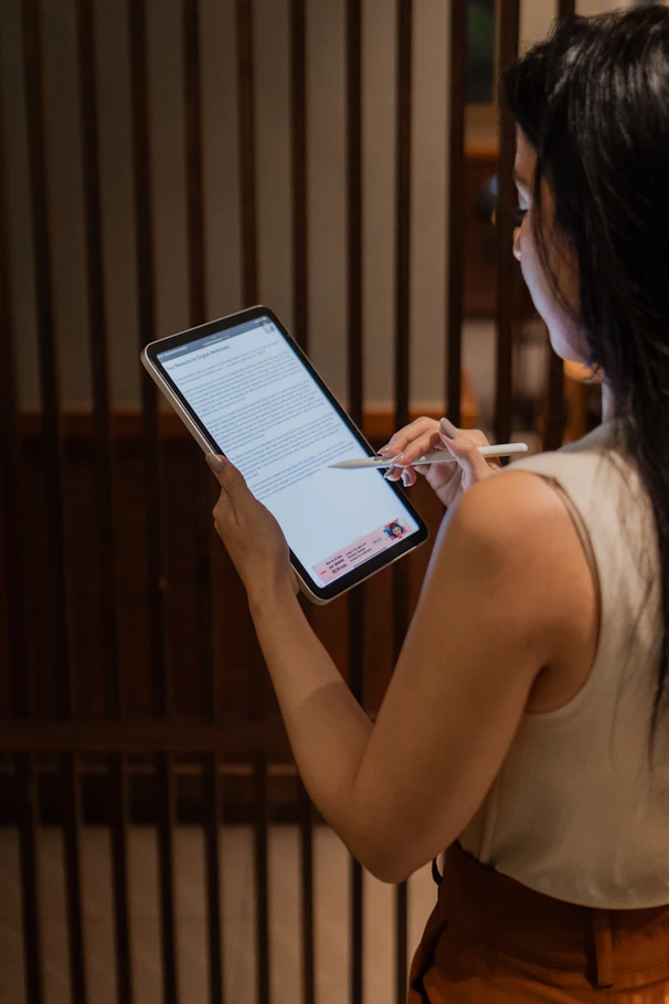 A woman holding a tablet in her hands