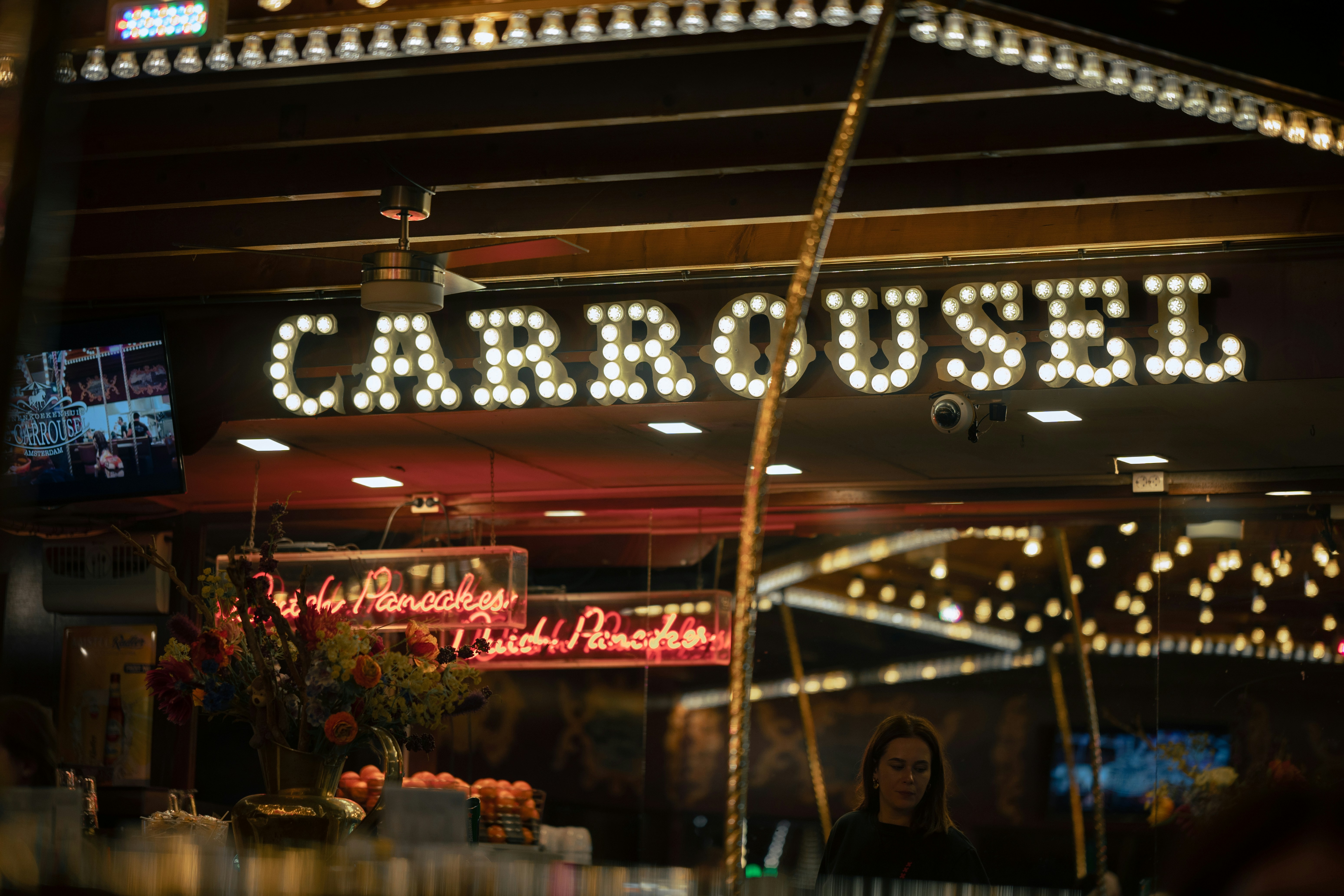 woman wearing yellow long-sleeved dress under white clouds and blue sky during daytime