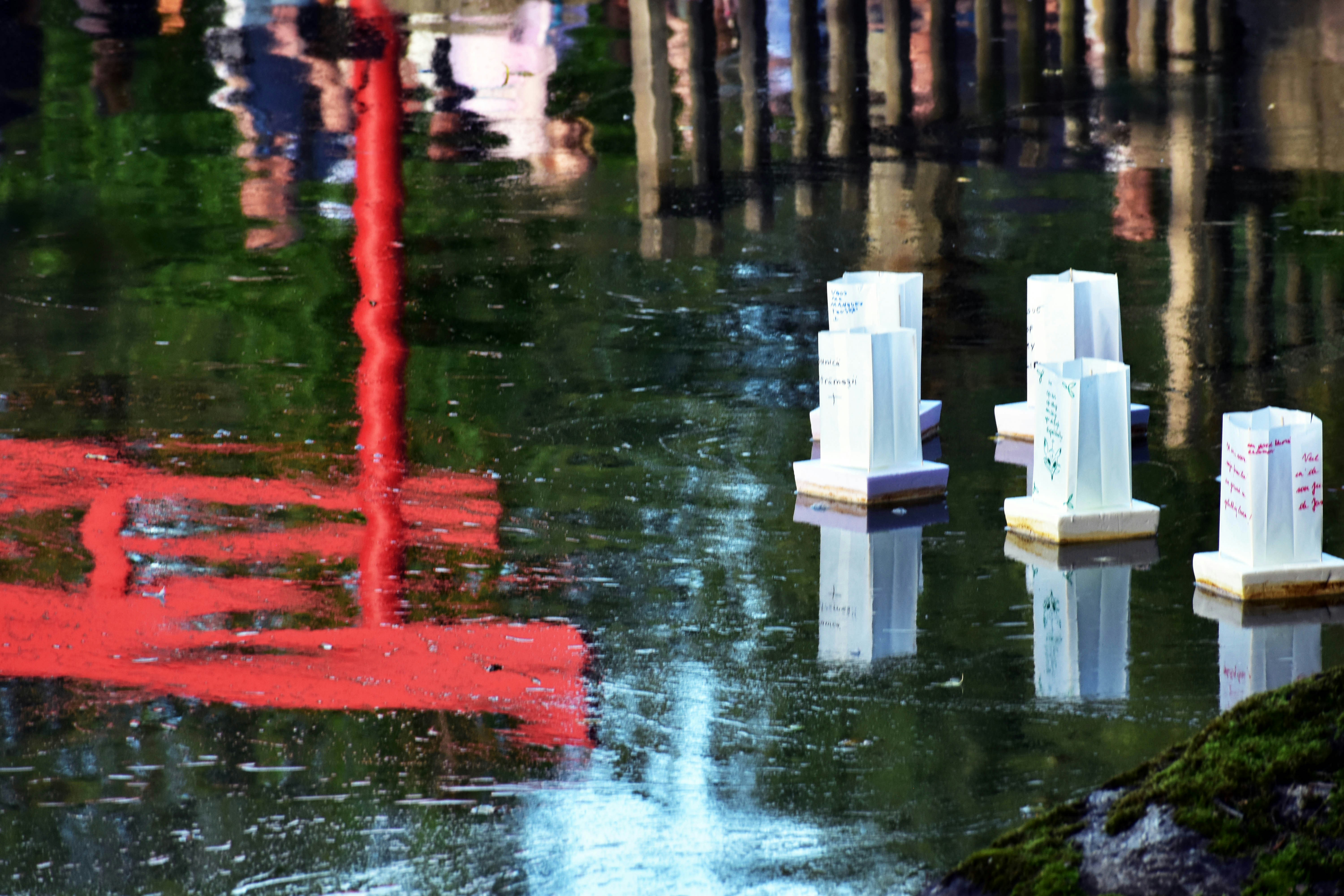 A group of white chairs sitting on top of a flooded street