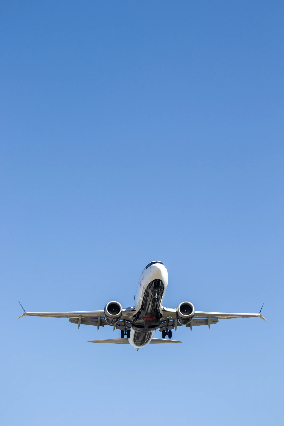 Airliner flying through a clear blue sky
