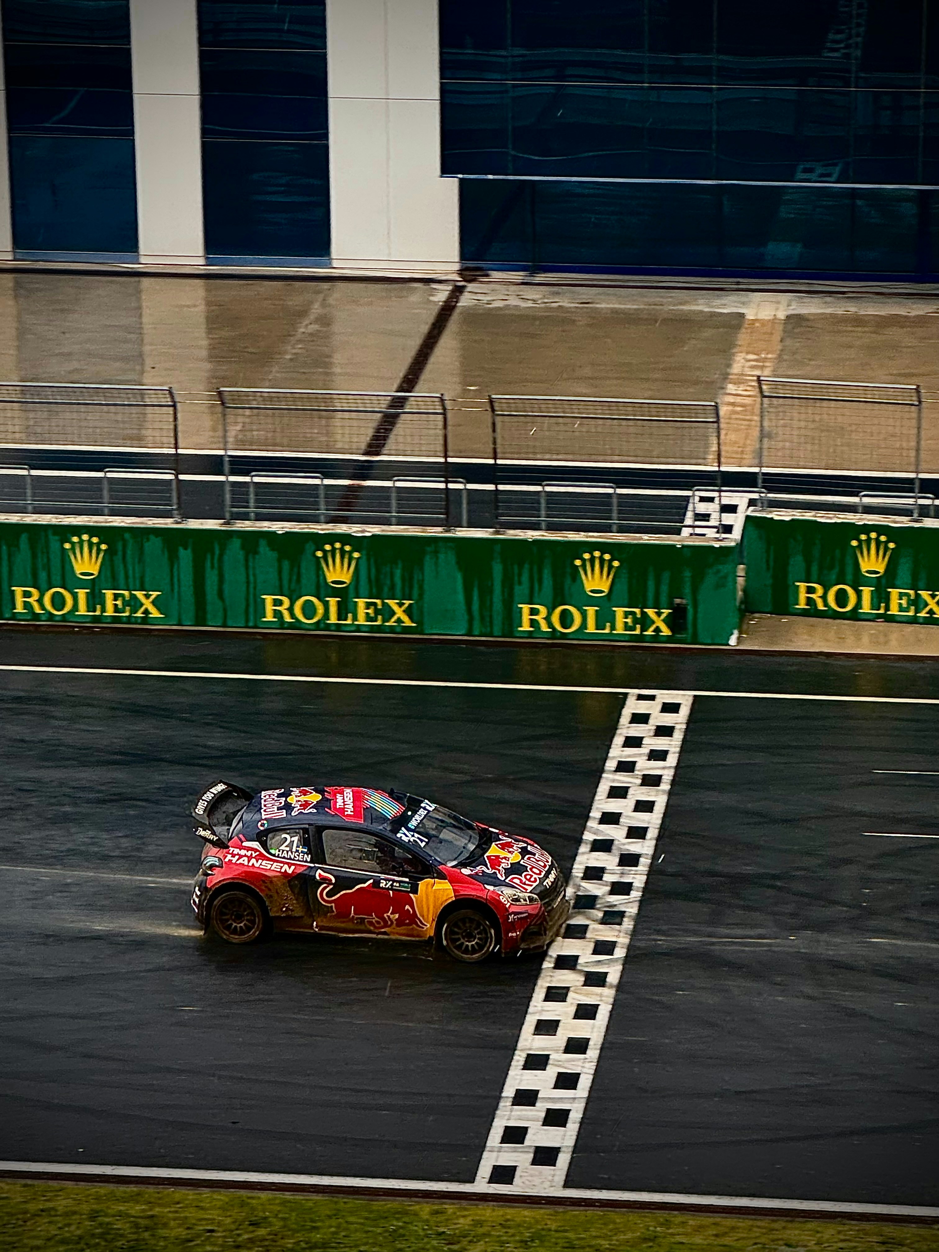 a-person-driving-a-car-on-a-race-track-yWtHhQCUVPE