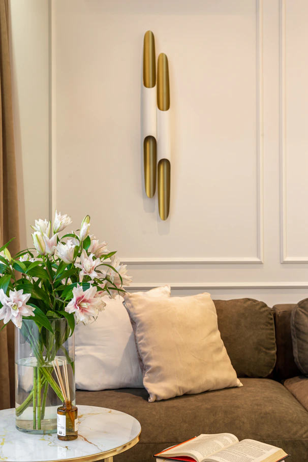 A living room filled with furniture and a vase of flowers