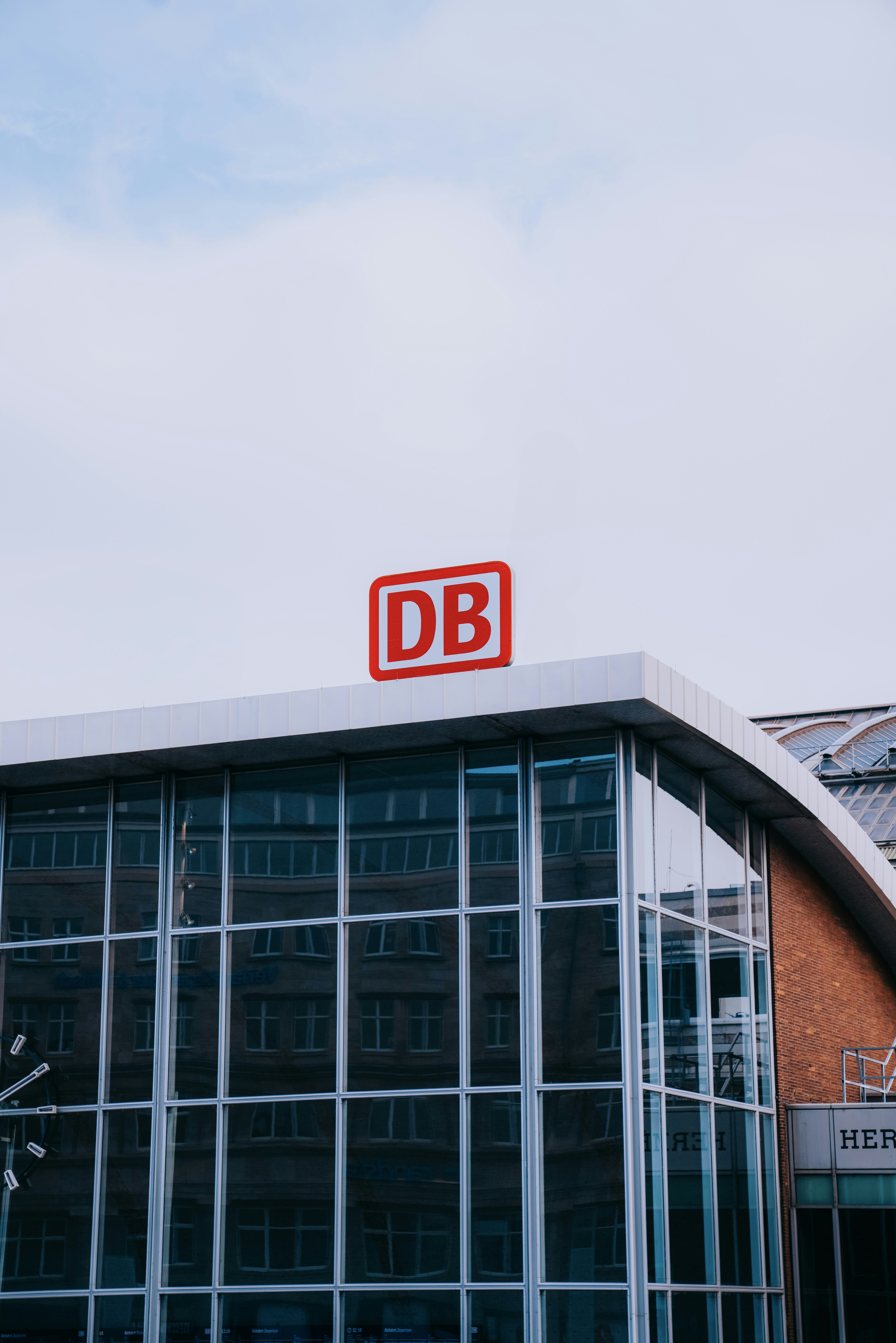 A large building with a red sign on top of it