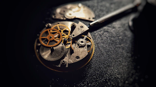 A close up of a pocket watch on a table