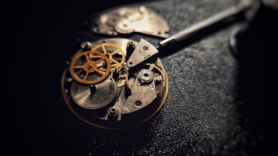 A close up of a pocket watch on a table