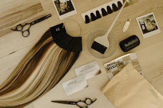 A table topped with a pair of scissors and a pair of scissors