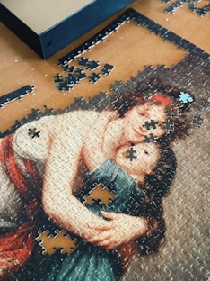 A picture of a woman holding a child on a puzzle