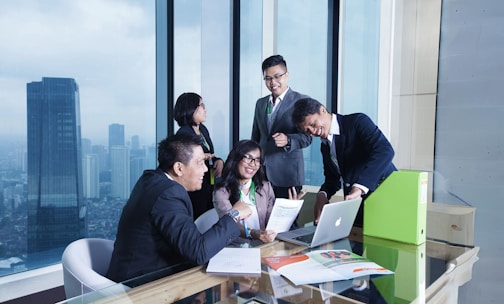 A group of business people sitting around a table
