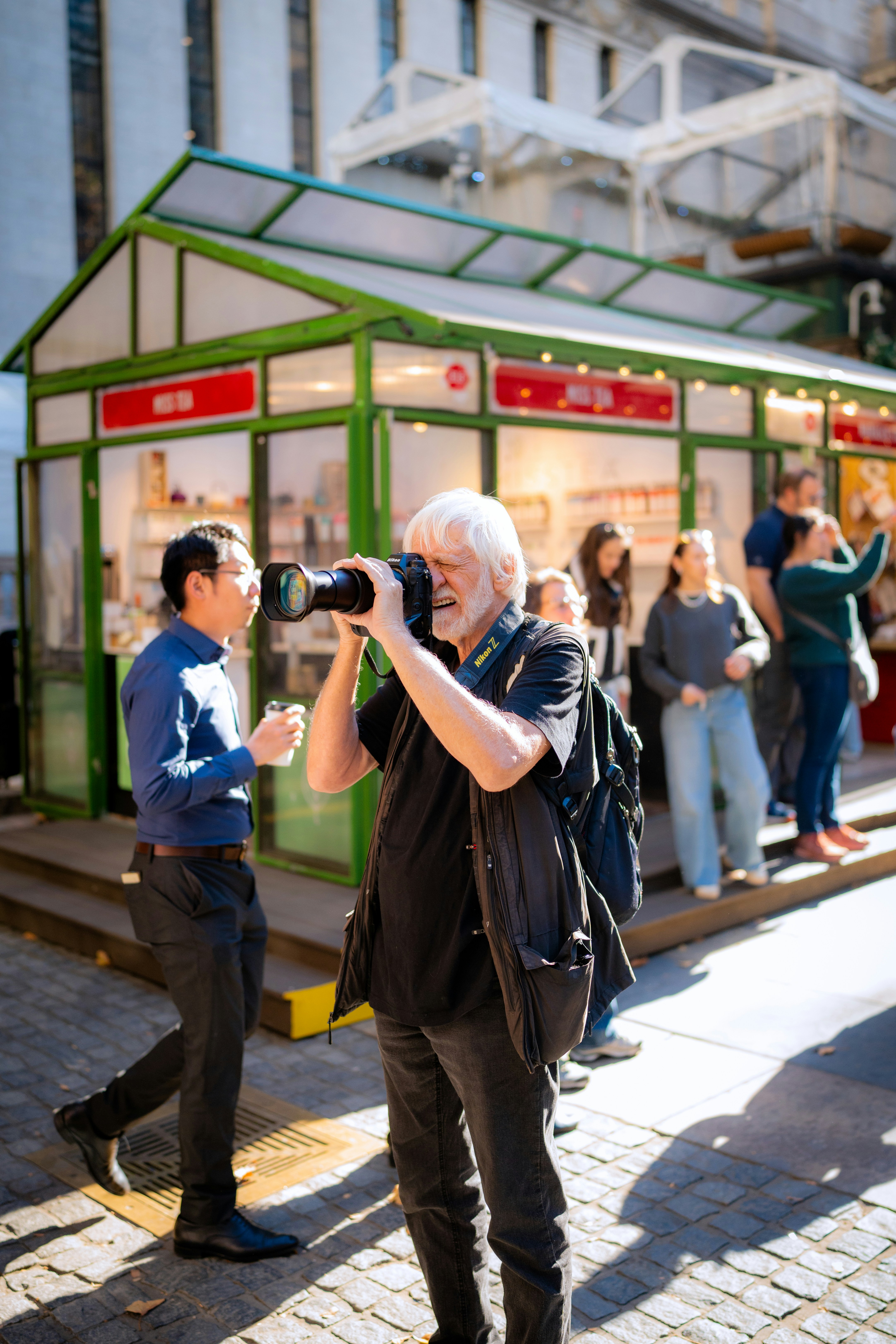A man taking a picture of a group of people