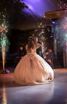 A man and a woman dance on a dance floor